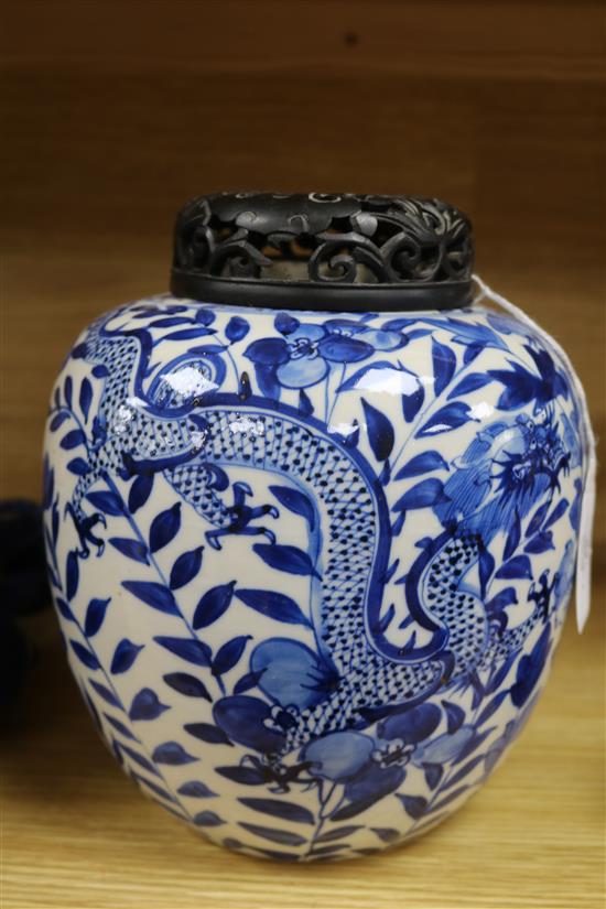 A Chinese blue and white jar, with hardwood cover height 22cm